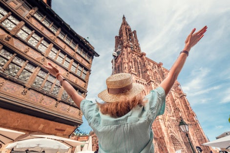 Photo of view to the famous Notre Dame Cathedral, tourist in Strasbourg, France.