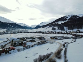 Photo of aerial view of Livigno town covered in snow in winter, Italy.