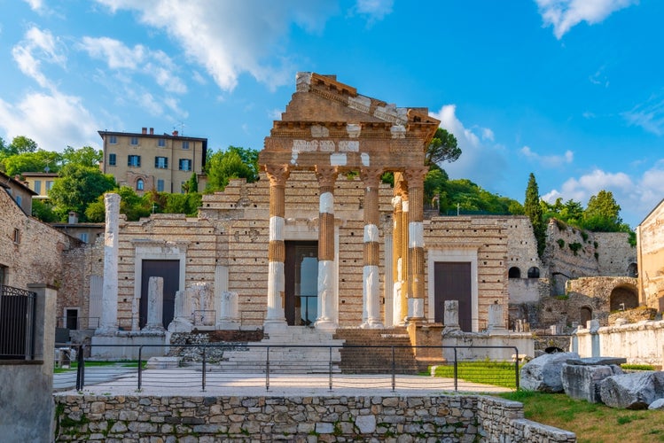 photo of view of Roman ruins of Tempio Capitolino in Brescia, Italy. 