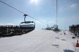 photo of panorama of ski resort with ski slopes and approaching snowstorm in Geilo, Norway.