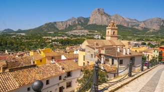 Photo of aerial panoramic view coastline and La Vila Joiosa Villajoyosa touristic resort townscape, sandy beach and Mediterranean seascape, Costa Blanca, Spain.