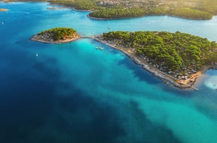 Photo of aerial view of beautiful town of Medulin waterfront view, Istria region of Croatia.