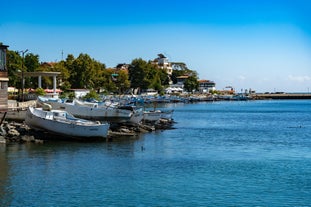 Photo of panoramic aerial view over small ancient resort town of Pomorie with old European small houses , Bulgaria.