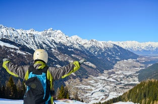 Photo of a view of the Alps from the Ehrwald, a town on the border of Germany and Austria with picturesque meadows surrounded by towering mountain ranges, including the Zugspitze.