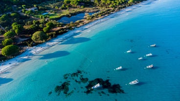 Photo of amazing landscape with wooden pier on Santa Giulia beach, Porto-Vecchio ,France.