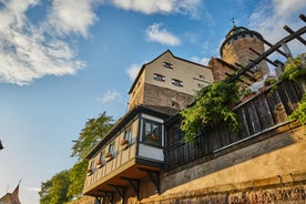 Photo of scenic summer view of the German traditional medieval half-timbered Old Town architecture and bridge over Pegnitz river in Nuremberg, Germany.