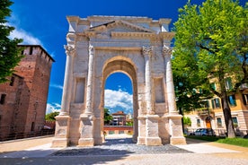 Photo of Italy Piazza Maggiore in Bologna old town tower of town hall with big clock and blue sky on background, antique buildings terracotta galleries.