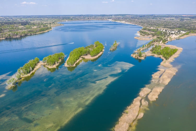 Photo of Beautiful lake with sand islands like atol. Lake pogoria in Dabrowa Gornicza Poland aerial drone photo view.