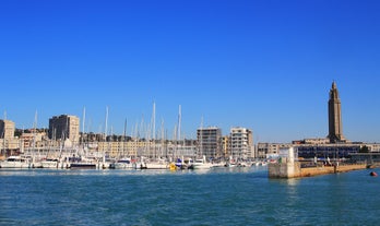 photo of Port of Deauville and city skyline in a sunny summer day, Normandy, France.