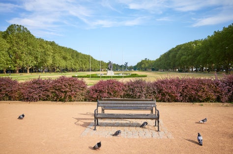 An empty bench in Jasne Blonia Kasprowicz Park in Szczecin, Poland.