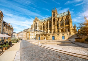 Photo of Metz city view of Petit Saulcy an Temple Neuf and Moselle River in Summer, France.