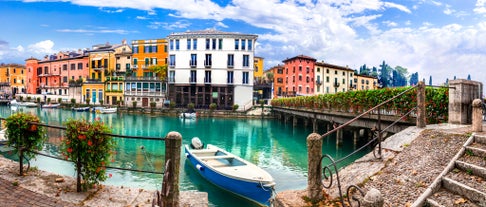 Photo of beautiful view of canal with statues on square Prato della Valle and Basilica Santa Giustina in Padova (Padua), Veneto, Italy.