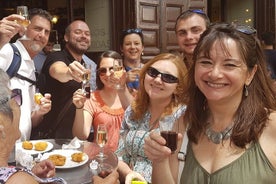 Tapas auténticas y almuerzo con historia o visita a pie con cena de Madrid