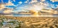 photo of landscape with Maspalomas town and golden sand dunes at sunrise, Gran Canaria, Canary Islands, Spain.