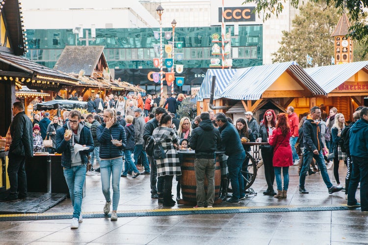 People walk on the street market on the famous Alexanderplatz square.jpg