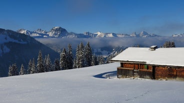 photo of an aerial view of Gstaad in winter. Village and holiday resort in the Swiss Alps.