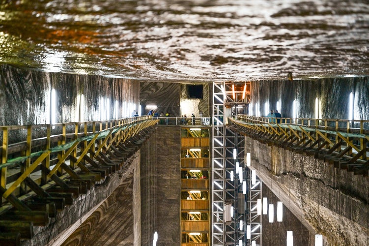 photo of view of Salina Turda salt mine in the city of Turda, Transylvania, Romania - The elevator with lighting in the popular travel destination and tourist attraction near Cluj