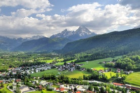 photo of Elevated, scenic view of the town of Bischofswiesen, Bavaria, Germany. The Watzmann Mountain, part of the Bavarian Alps rises into a majestic skyline. A green, spring landscape set in the valley.