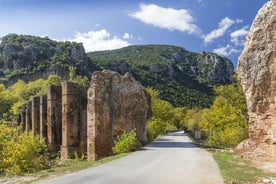 Photo of temple of Apollo with Acrocorinth in the background. Ancient Corinth, Greece.