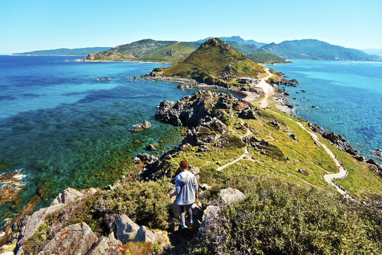 Photo of Young Girl walk down from Genoese Tower of Parata peninsula, Ajaccio.