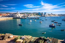 Photo of aerial view over People Crowd Having Fun On Beach And Over Cascais City In Portugal.