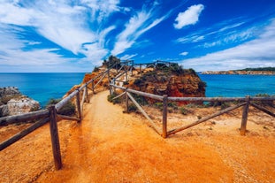 Photo of Carvoeiro fishing village with beautiful beach and colourful houses, Portugal.