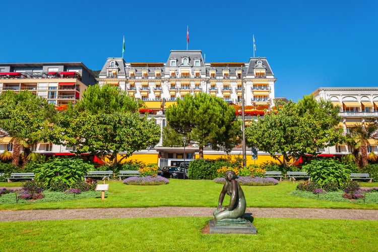 Public park in Montreux. Montreux is a town on the shoreline of Lake Geneva at the foot of the Alps in Switzerland