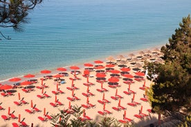 Photo of panoramic aerial view of the popular Platis Gialos beach on the Greek island of Mykonos with turquoise sea, Greece.