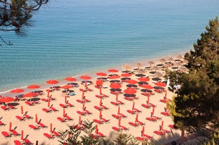 Photo of panoramic aerial view of the popular Platis Gialos beach on the Greek island of Mykonos with turquoise sea, Greece.