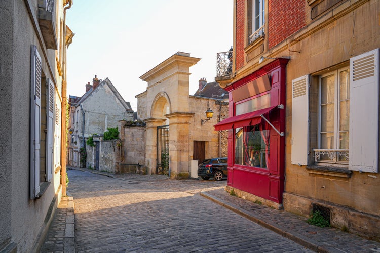 photo of view of Old cobbled street of the medieval city center of Senlis in Oise, Picardy, France.