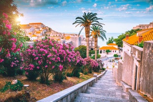 Photo of panorama and landscape of Makarska resort and its harbour with boats and blue sea water, Croatia.