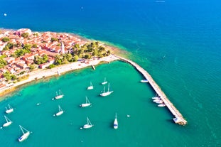 Photo of aerial view of town of Rovinj historic peninsula , famous tourist destination in Istria region of Croatia.