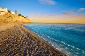 Photo of aerial panoramic view coastline and La Vila Joiosa Villajoyosa touristic resort townscape, sandy beach and Mediterranean seascape, Costa Blanca, Spain.