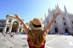 Famous buildings, gondolas and monuments by the Rialto Bridge of Venice on the Grand Canal, Italy.