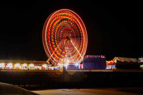 Photo of Blackpool Tower and Central Pier Ferris Wheel illuminated at night, Lancashire, England, UK.