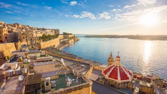 Aerial view of Lady of Mount Carmel church, St.Paul's Cathedral in Valletta embankment city center, Malta.