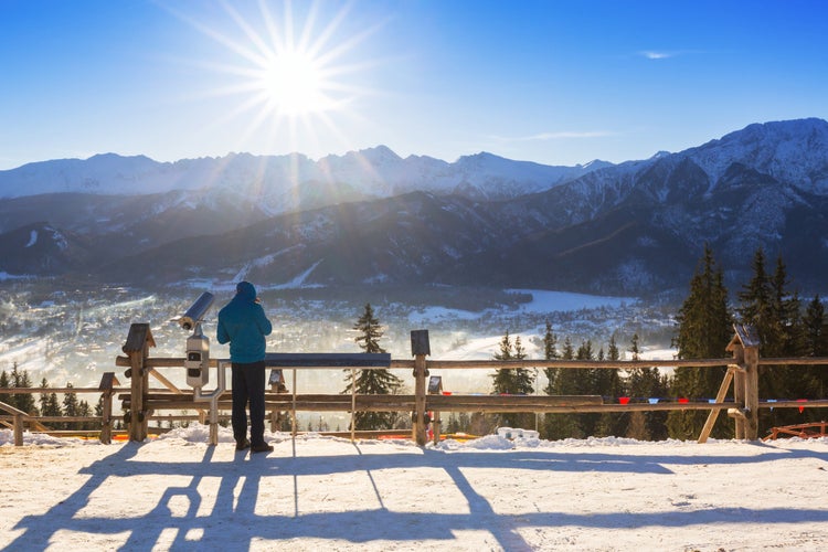 photo of a man in Zakopane at Tatra mountains in winter time, Poland.