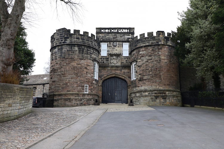 photo of view of Entrance to Skipton Castle on a grey cloudy day, Craven, England.