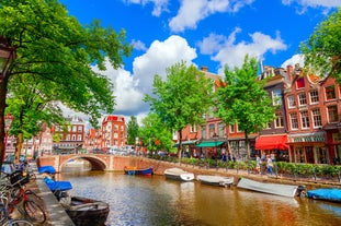 Amsterdam Netherlands dancing houses over river Amstel landmark in old european city spring landscape.