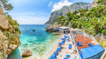 Photo of aerial view of Capri island in a beautiful summer day in Italy.