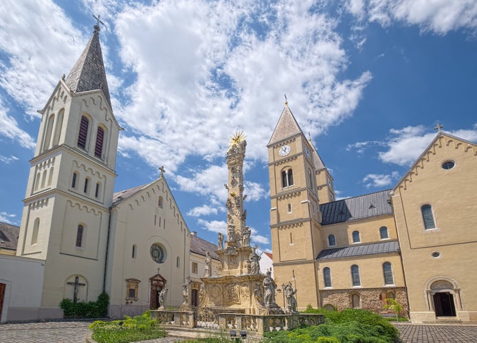 Saint Michael Cathedral, Holy Trinity Column and Franciscan Church, historic buildings and the most prominent landmarks in the Castle of Veszprem town, Hungary.