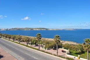 Photo of panoramic aerial view of St. Paul bay with acropolis of Lindos in background ,Rhodes, Greece.