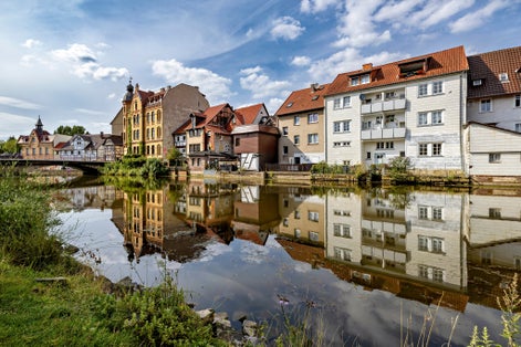 Photo of Reflection of houses in the Werra river in Eschwege Germany.