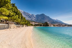 Photo of aerial view on Adriatic Sea and Baska Voda place in Makarska Riviera, Dalmatia region, popular tourist summer resort in Croatia.