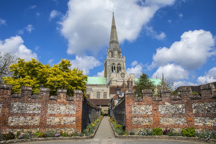 A view of the spire of Chichester Cathedral and St. Richards Walk in the historic city of Chichester in Sussex, UK.