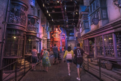 Visitors wander through the Diagon Alley movie set, at the Making of Harry Potter Studio tour at the Warner Bros. Studios in Leavesden, UK.
