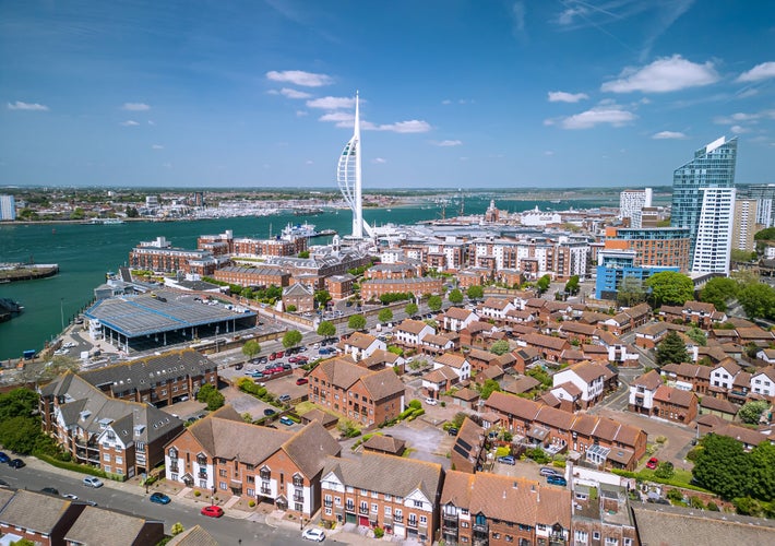 The drone aerial view of Spinnaker Tower and Portsmouth Harbour. Portsmouth is a port city and unitary authority in Hampshire, England.