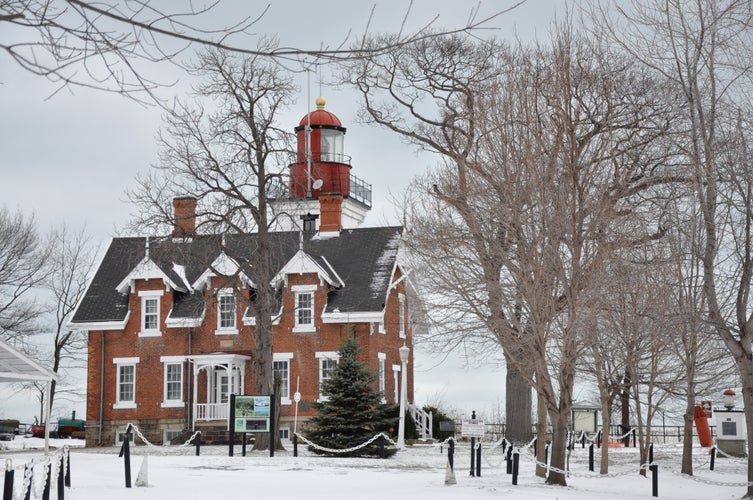 Photo of Dunkirk Lighthouse in the snow ,France .