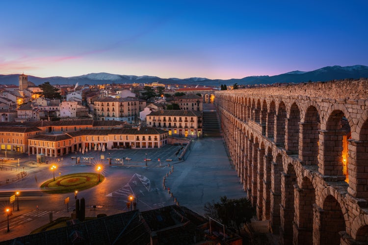 photo of view of Aqueduct of Segovia and Plaza Oriental Square at sunset - Segovia, Spain.