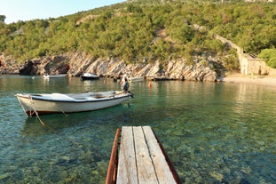 photo of  Pláž Senj it's a small beach hidden by vegetation near the Adriatic Sea, Senj, Croatia.